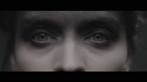a woman dressed as mother opens her eyes