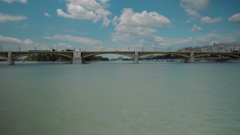 Boat-ride-through-Danube,-summer-afternoon,-Petofi-bridge,-long-panning