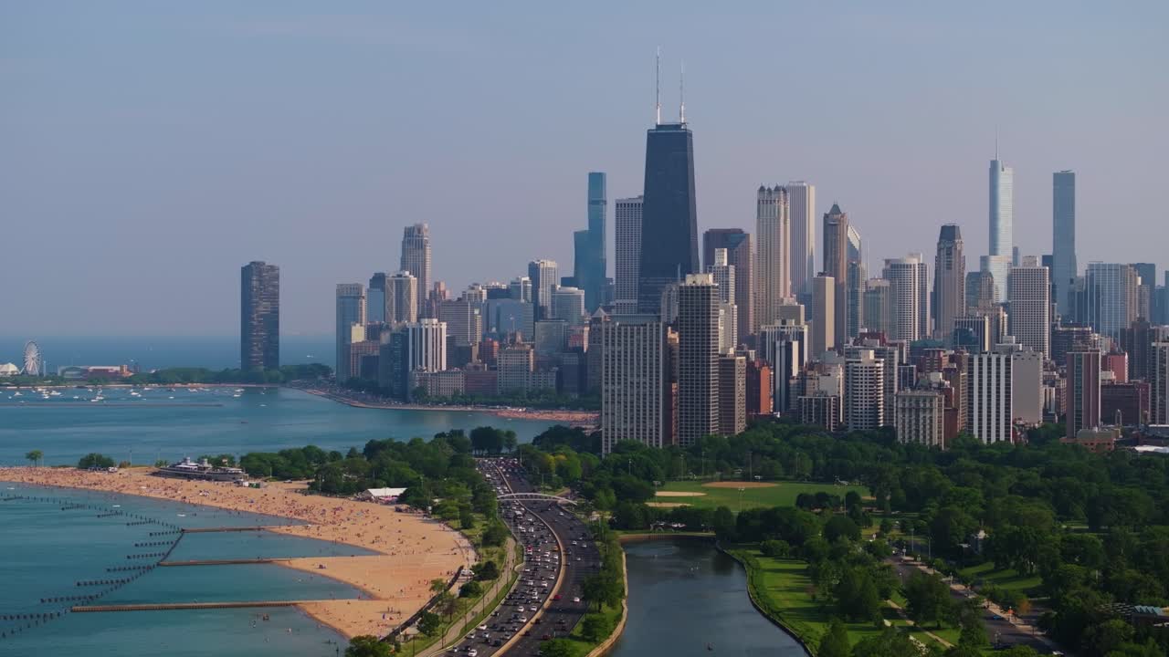 Drone Ascends to Reveal Chicago Skyline. North Avenue Beach and Lake Michigan