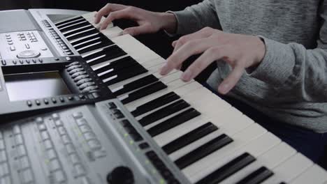 man playing the electric piano