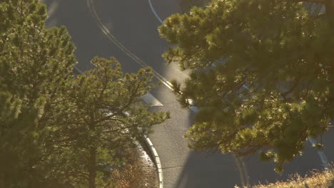 Aerial-view-of-biker-riding-in-the-mountains