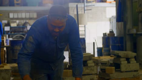 worker arranging metal mold in foundry workshop 4k