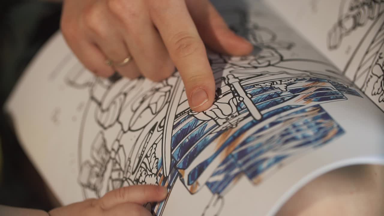 Coloring book with hand pointing