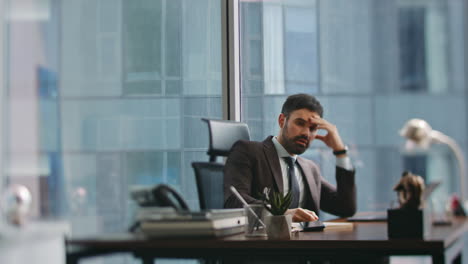 furious businessman finish call angry about displeased conversation in office .