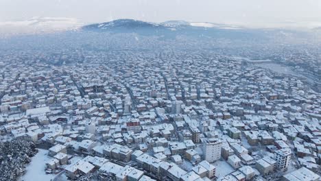 aerial urban city snowing