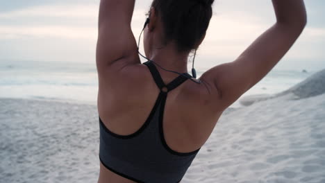 fitness, stretching and woman on beach