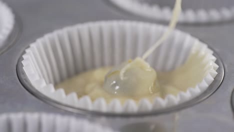 Cake-batter-pouring-into-the-muffin-mold