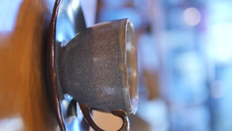 gray ceramic coffee cup on wooden table