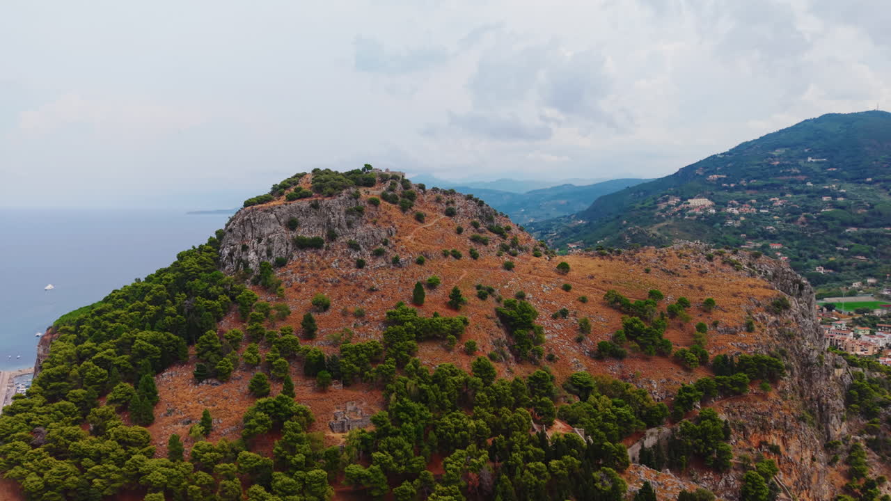 Aerial view of Cefalù, Sicily's mountain with lush greenery and rocky cliffs