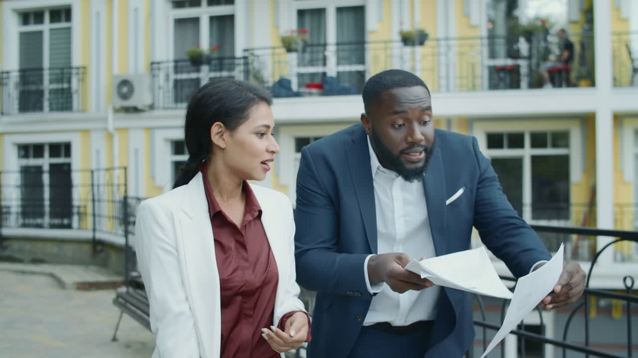 Irritated managers examining data outdoors