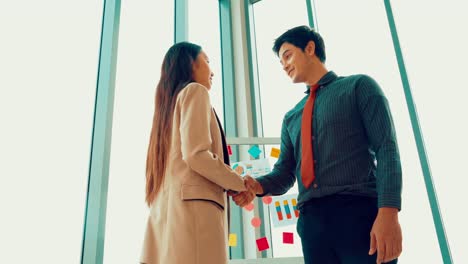 business people handshake in corporate office