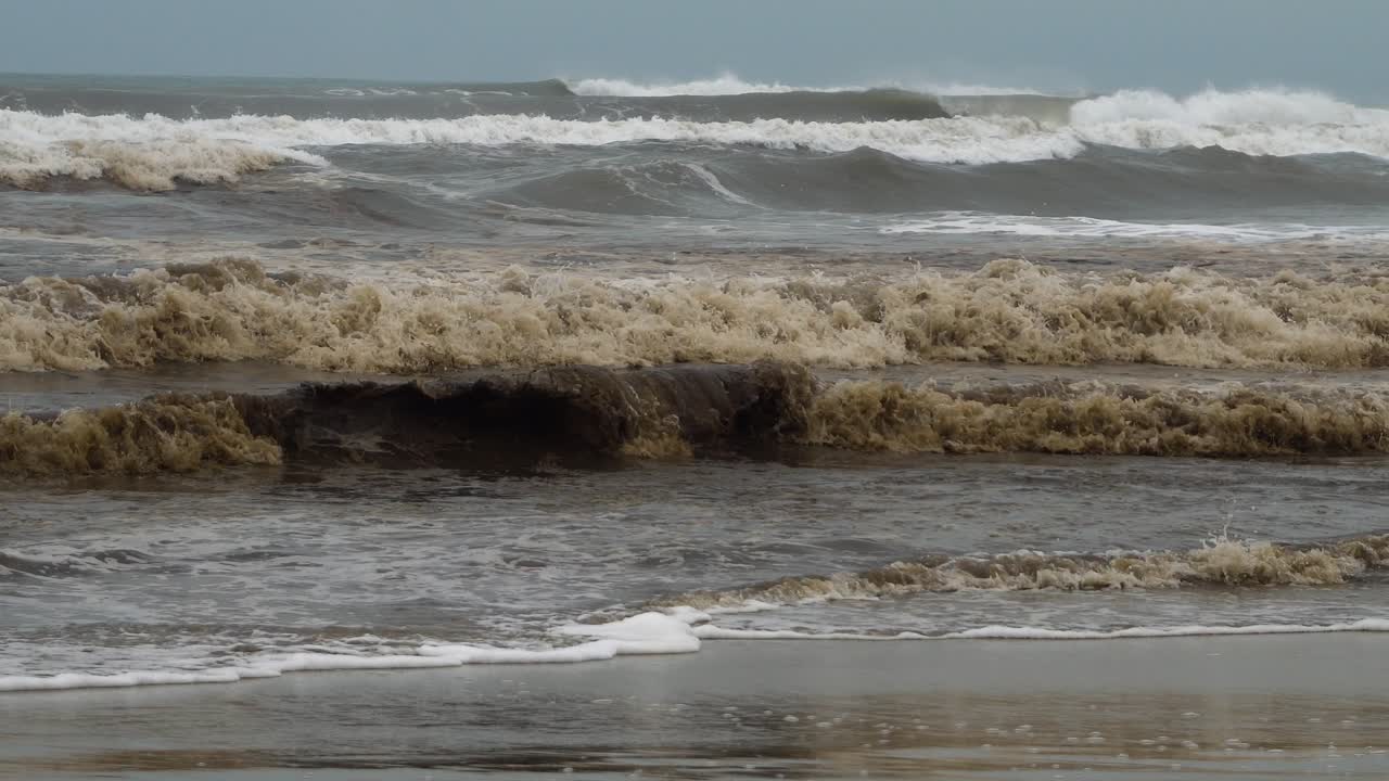 Very polluted beach and water in the ocean full of trash beach