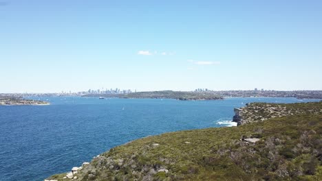 aerial flight over the rugged coastline of north head, manly