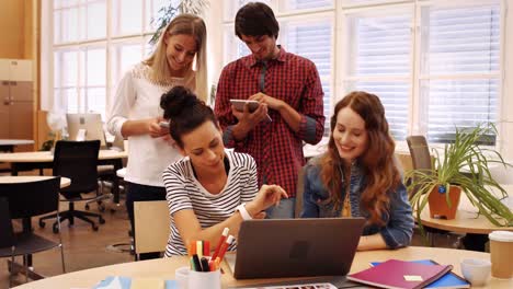 group of business executives using digital tablet and mobile phone