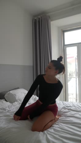 woman posing on a bed