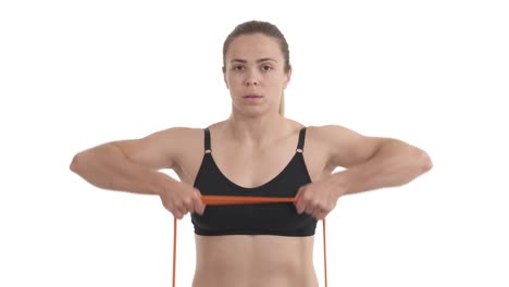 portrait of blond sportswoman doing shoulder muscle training with resistance loop bands. isolated on white background.