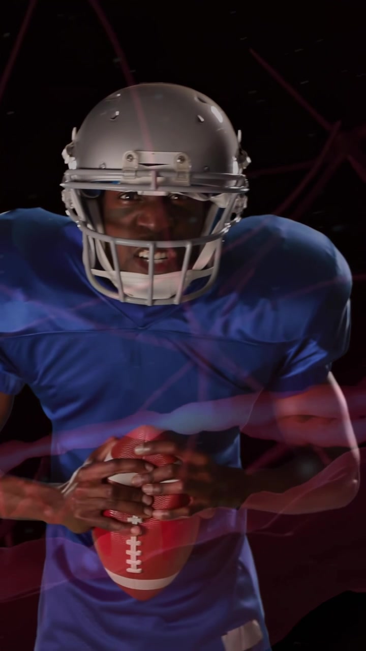 Video verticale: Uno sportivo tocca la maschera, tenendo una palla al petto, con un'overlay cerebrale che vortica mentre si prepara al gioco.