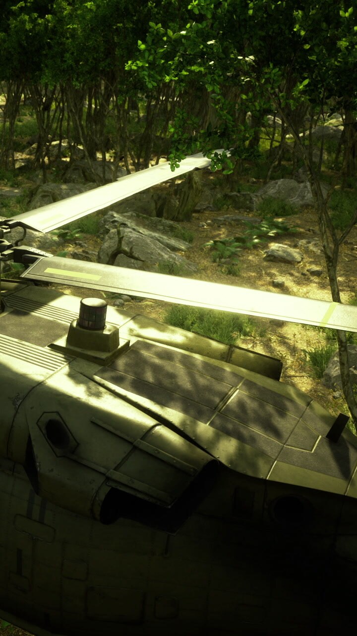 Helicopter resting in forest during daytime near rocky terrain