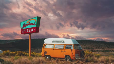 Cinemagraph---seamless-video-loop-of-an-old-rusty-vintage-Volkswagen-VW-T2-Camper-Van-standing-in-the-desert-of-Arizona-next-to-an-old-abandoned-neon-sign