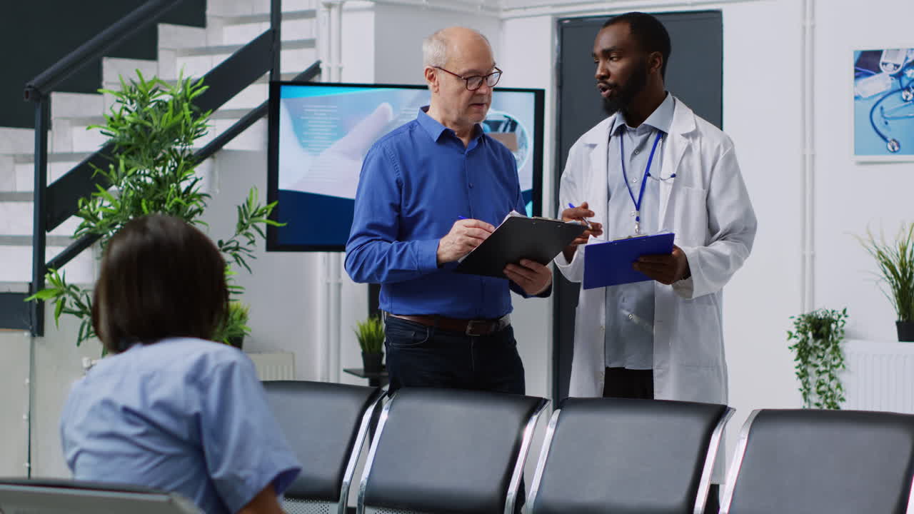 Doctor consulting with patient in waiting room