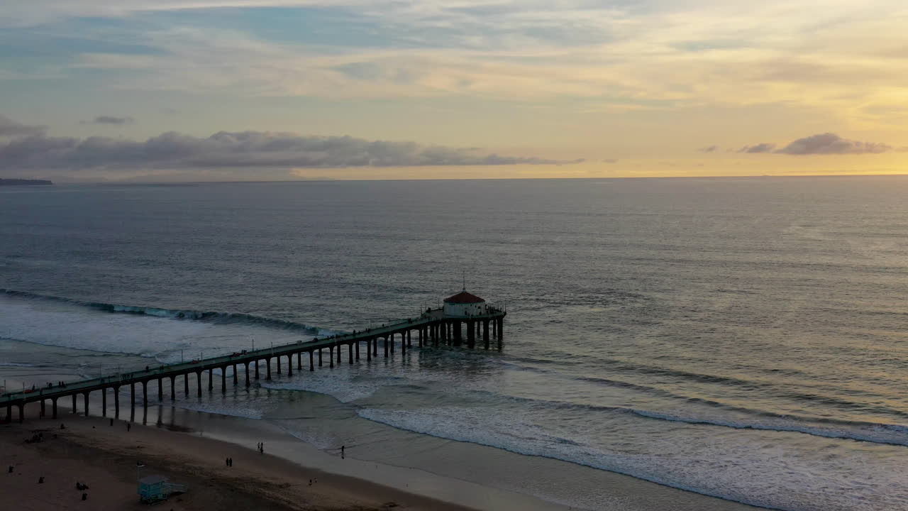Aerial shot of Manhattan Beach, California, USA. Drone shot of Manhattan Beach Pier with the Roundhouse Aquarium at dusk