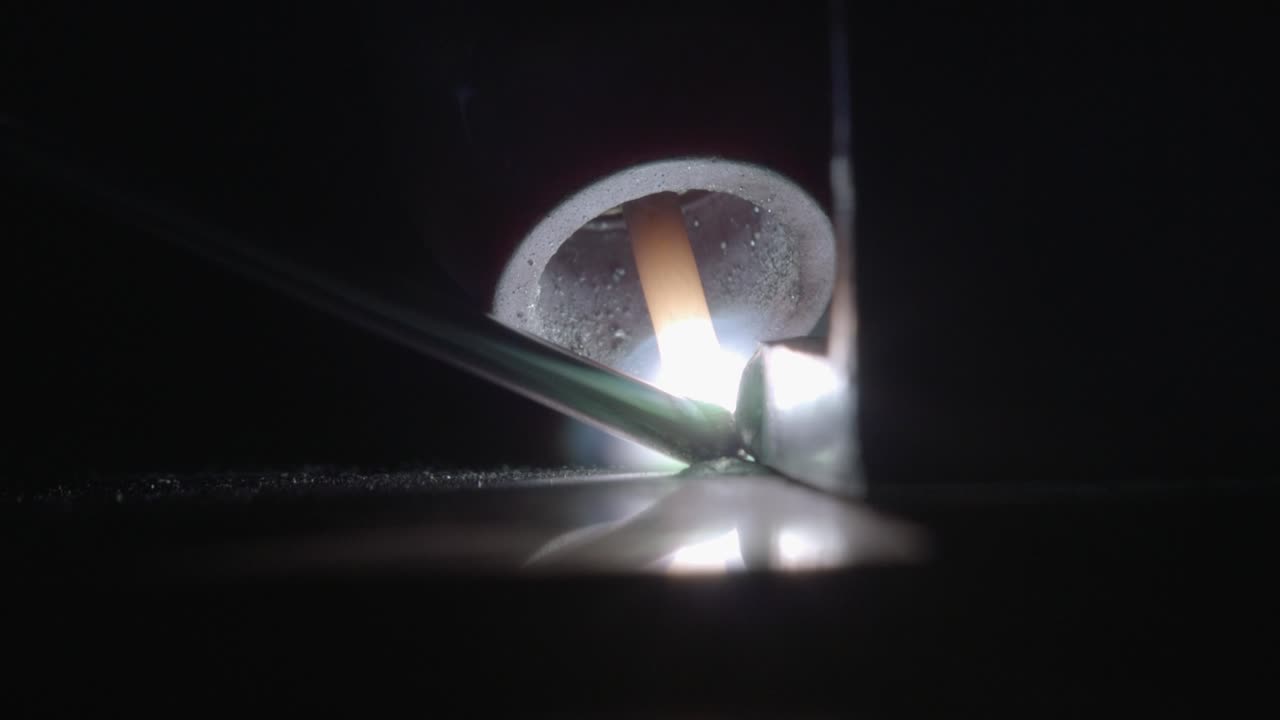 Welding Close Up. Blinking Light and Melting Steel, Macro Shot