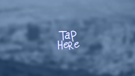 animation of tap here text over blurred background