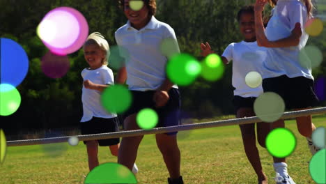 moving spots of coloured light with children running