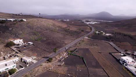 Aerial-shot-of-moving-clouds-and-volcanos-in-background