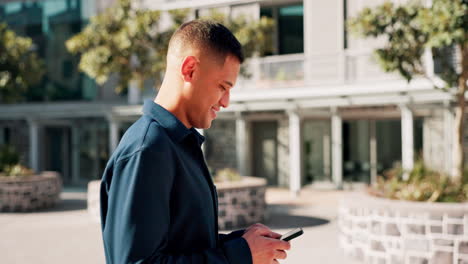 Latino-man,-walking-in-city-with-smartphone