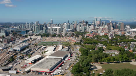 Magnificent-view-Of-The-CBD,-soccer-fields-and-the-St-Paul's-Hospital-and-Health-Campus-under-construction-in-Vancouver-Canada---aerial-shot