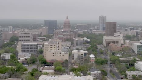 wide shot drone parallax view of texas state capitol building in austin, texas with circle