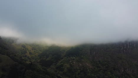 A-foggy-mountain-valley,-where-the-mist-rises-and-falls,-creating-a-mystical-atmosphere