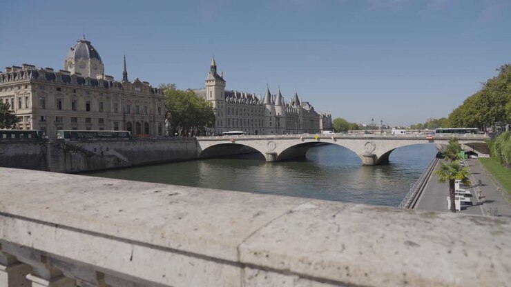 Wider Angle Shot Of Pont Saint Michel Bridge Crossing River Seine In Paris France With Tourists And Traffic