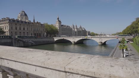 wider angle shot of pont saint michel bridge crossing river seine in paris france with tourists and traffic