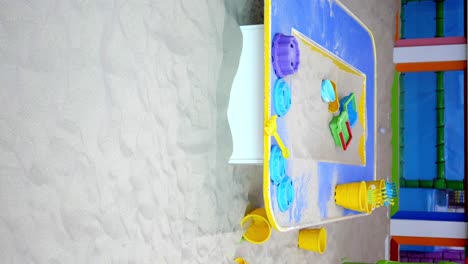 indoor play area with sand table and toys