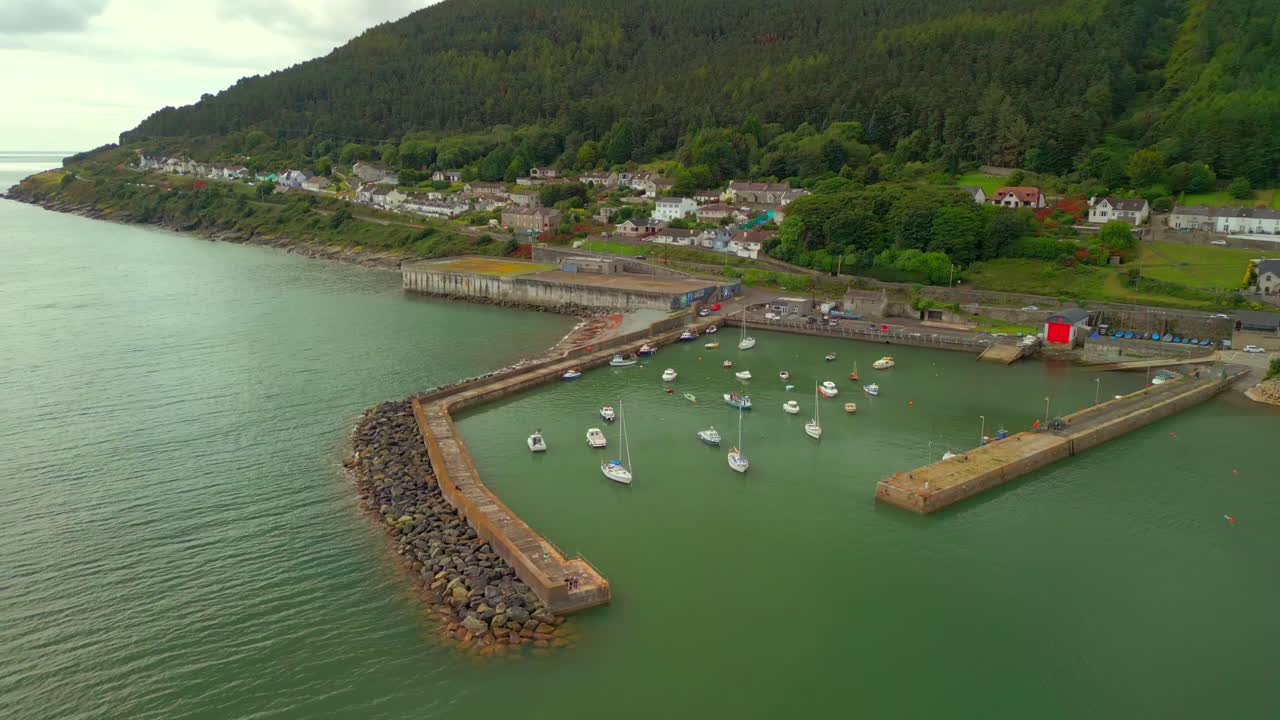 Reversing aerial video of Newcastle Harbour in County Down, Northern Ireland. Filmed in 4K, 60FPS and with Rec709 color