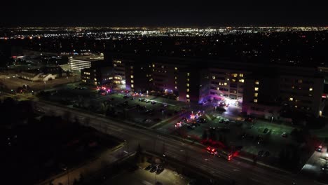 Emergency-services-respond-to-fire-alert,-Brampton-Civic-Hospital,-night-aerial