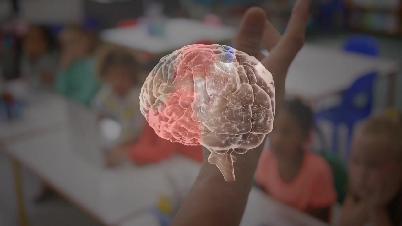 Teacher hand entering left and raising, projecting rotating 3D brain RGB zones, students learning