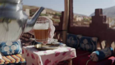 serving tea on a moroccan terrace