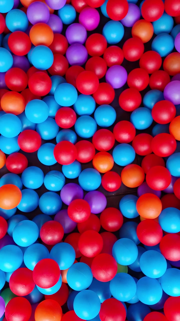 Colorful Plastic Balls in a Children's Play Pit