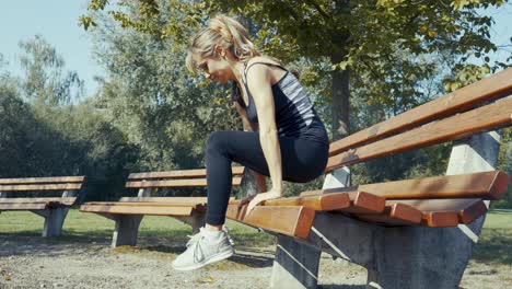 4k-shot-of-young-beautiful-women-doing-exercises-outdoor-in-a-park-at-sunrise