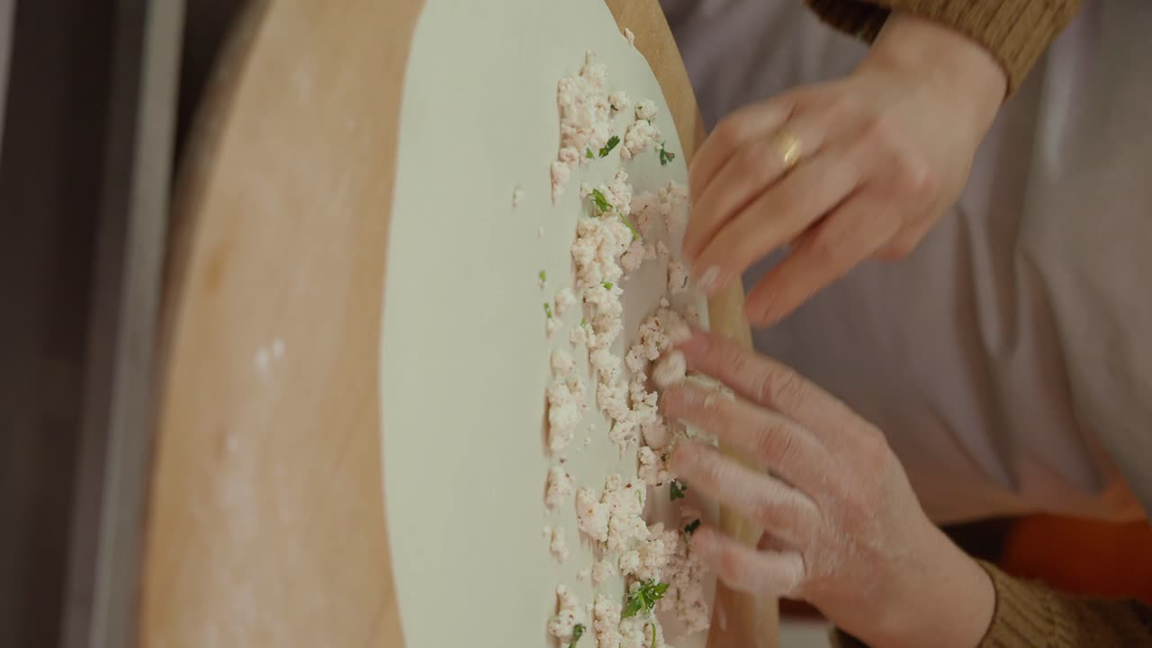 Preparing a homemade pastry with filling