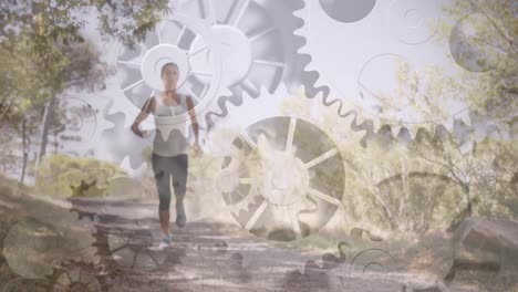 Animation-of-cogs-spinning-over-fit-woman-running