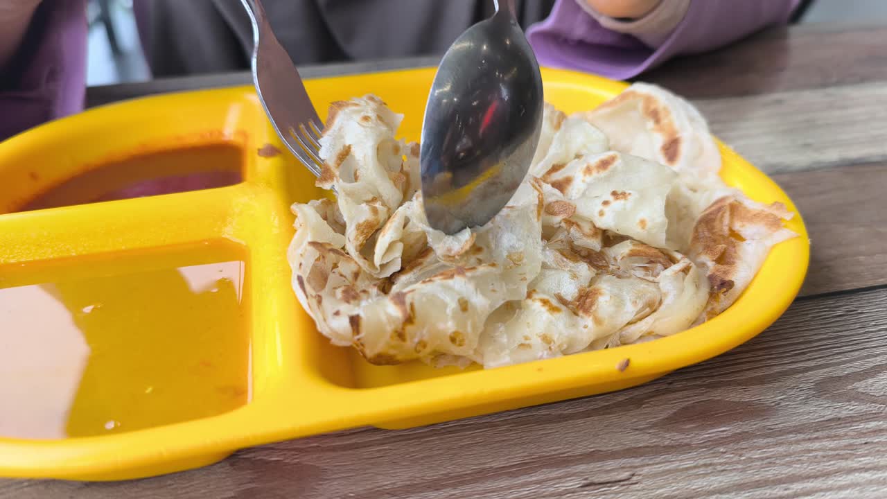 Roti Canai is Malaysia's most popular breakfast. This delicious, flaky flatbread is traditionally served with savory curries, making it a perfect morning meal