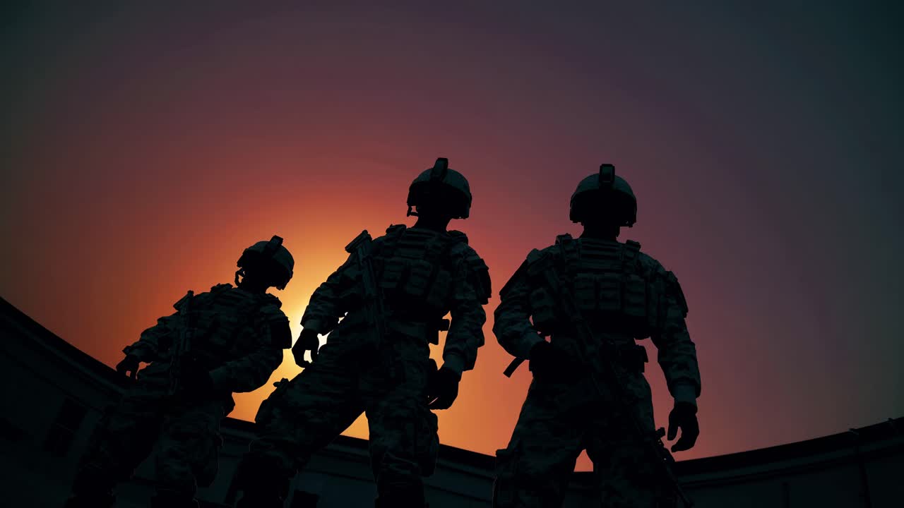 Silhouetted soldiers stand against a vibrant sunset, captured from a low-angle, creating a dramatic