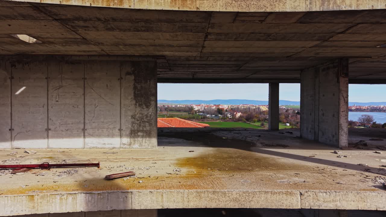 Modern construction site overlooking rural landscape under clear skies