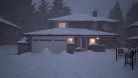 snow gently falling on a cozy house for sale during a nighttime snowstorm, creating a warm and inviting atmosphere that contrasts beautifully with the chilly winter weather