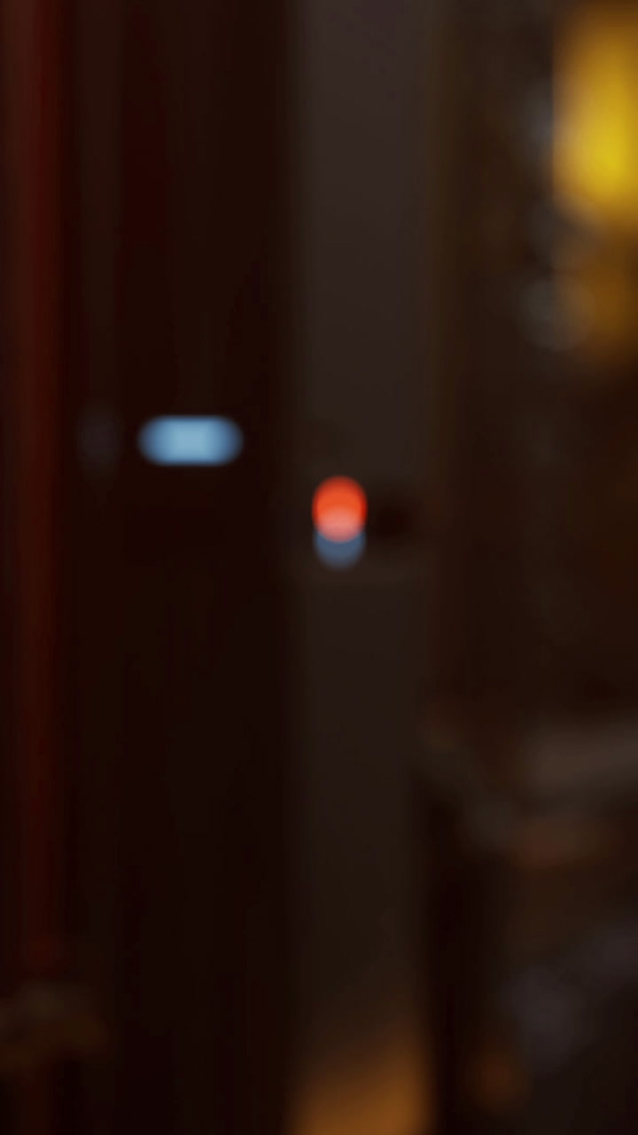 Blurred vibrant lights fill the background of a cozy evening gathering