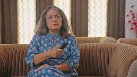 old indian woman watching tv